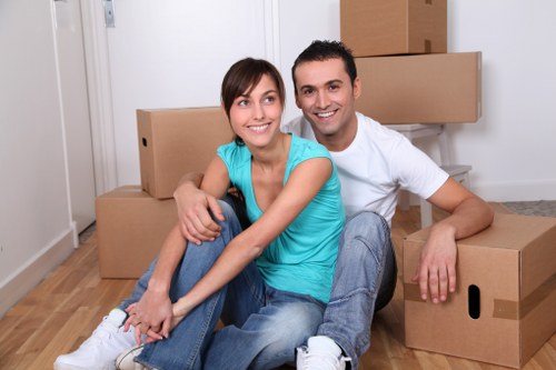 Staff following safe working practices during a removal service