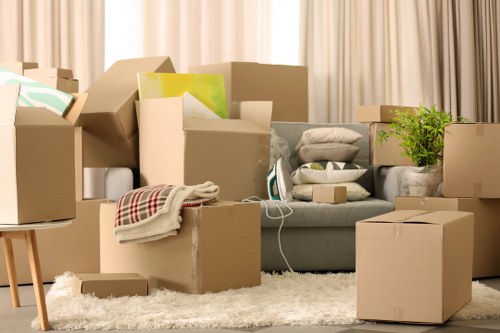 Loading household boxes and furniture into a removal van